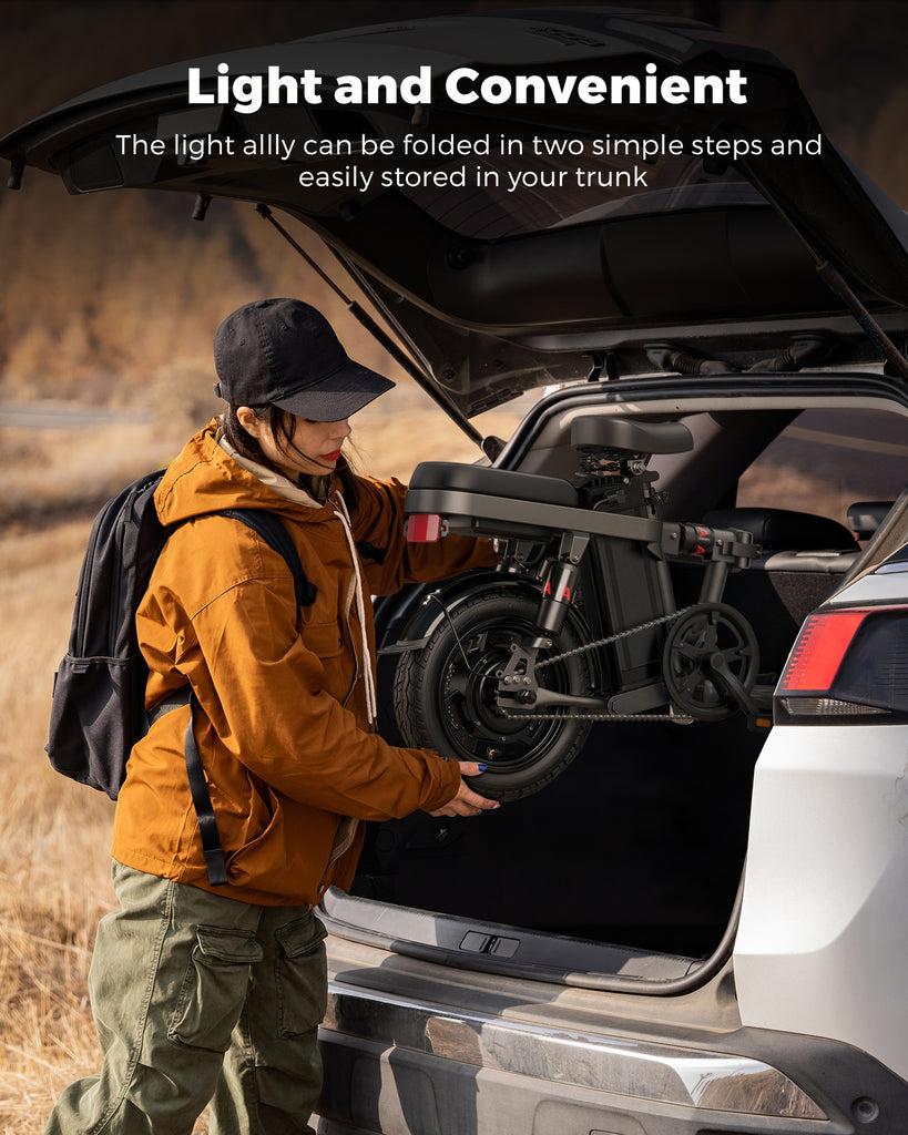 a lady is putting a folded engwe t14 into the trunk of a car